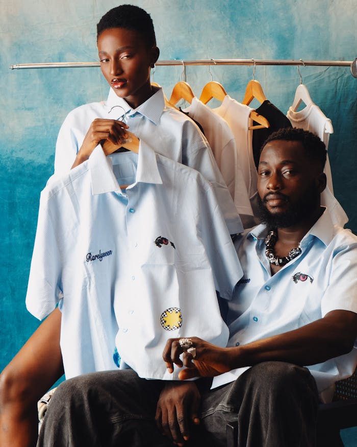 Fashionable portrait of two models showcasing custom embroidered shirts.